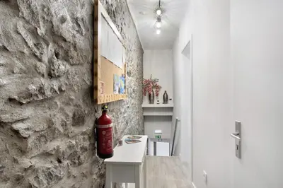 a room with a fire extinguisher on a wall at Família Dória Nóbrega Estúdio in Funchal