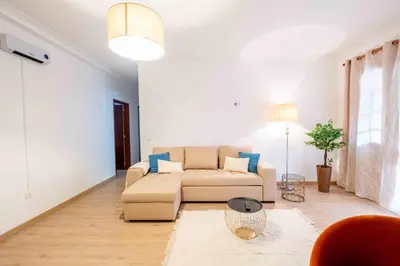 a living room with two chairs and a couch at Casa do Neves in Funchal