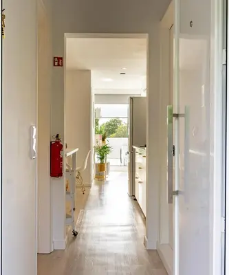 an open hallway with a kitchen and a living room at gate15 in Machico