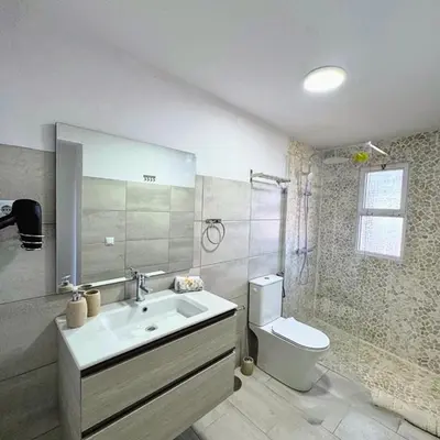 a bathroom with a sink and a toilet at Casa D'Avó Filó in Funchal
