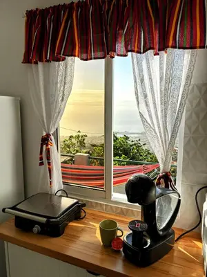 a table with a blender and a window at Casa D'Avó Filó in Funchal