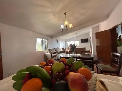 a bowl of fruit on a table in a living room at Vila Pico da Torre Apartment in Câmara de Lobos