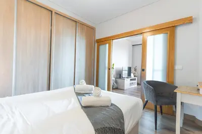 a bedroom with a bed with two stuffed animals on it at Figueiras House by Atlantic Holiday in Câmara de Lobos
