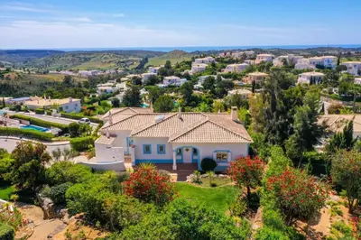 an aerial view of a house at Parque da Floresta villa 209 with pool on golf resort in Budens