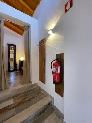a fire hydrant hanging on a wall in a room at Casa da Figueira - Guest House in Figueira