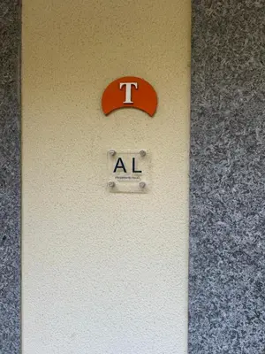 a sign on a wall with a t alphabet on it at TMaria in Ponta do Sol