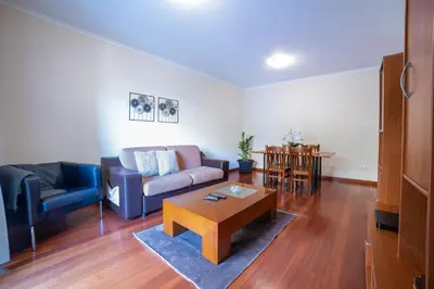 a living room with a couch and a table at TMaria in Ponta do Sol