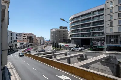 a view of a city street with cars and buildings at Golden City by An Island Apart in Funchal