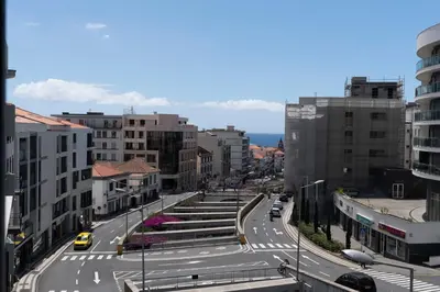 a street in a city with cars on the road at Golden City by An Island Apart in Funchal