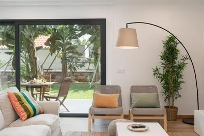 a living room with a couch and two chairs at Germana House by An Island Apart in Ponta do Sol