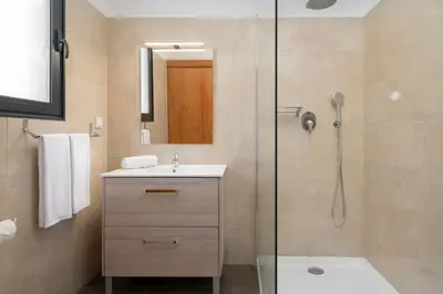 a bathroom with a shower and a sink and a toilet at Germana House by An Island Apart in Ponta do Sol