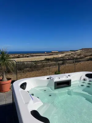 a bath tub with a view of the ocean at B&B Camacha Porto Santo in Porto Santo