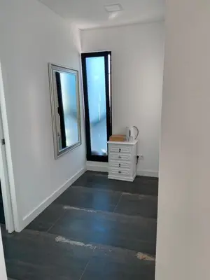 an empty room with a mirror and a dresser at B&B Camacha Porto Santo in Porto Santo