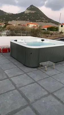 a hot tub sitting on top of a roof at B&B Camacha Porto Santo in Porto Santo