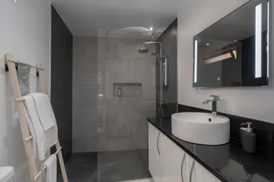 a bathroom with a sink and a shower at Casa das Maravilhas by An Island Apart in Câmara de Lobos