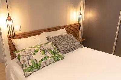 a bedroom with a bed with a pillow on it at HOMELIKE FUNCHAL II in Funchal