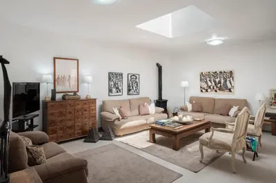 a living room with two couches and a coffee table at Casa de Férias by An Island Apart in Porto Santo