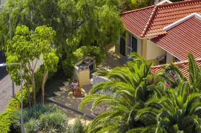 an overhead view of a house with palm trees at Casa de Férias by An Island Apart in Porto Santo