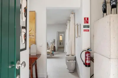 a hallway with a green door and a room at Casa de Férias by An Island Apart in Porto Santo