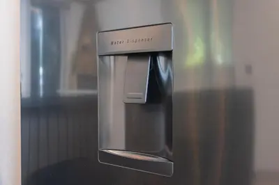 a close up of a microwave with a dispenser at Casa Requinte - Jacuzzi in Arco da Calheta