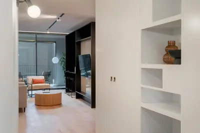 a living room with a couch and a table at Savoy Insular II by An Island Apart in Funchal