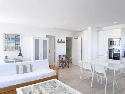 a living room with a white couch and a table at Beach Retreat Steps from the Ocean #1953 in Luz