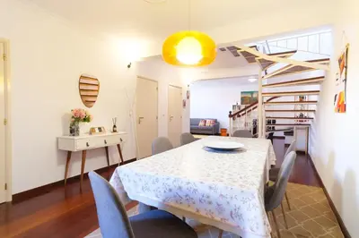 a dining room with a table and chairs at GuestReady - Aragão Guest house in Funchal