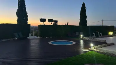 a patio with a pool in the middle of a yard at Eco Natura Falcoeira - Praia da Luz in Montinhos da Luz