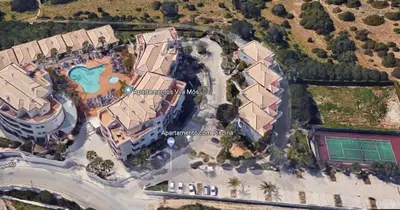 an overhead view of a house with a pool at Bel appartement 2 pieces, bord de mer et vue mer in Lagos