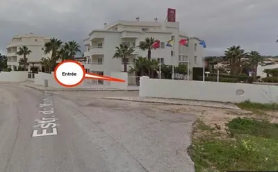 a red frisbee in front of a house at Bel appartement 2 pieces, bord de mer et vue mer in Lagos