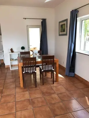 a dining room with a table and two chairs at Bel appartement 2 pieces, bord de mer et vue mer in Lagos