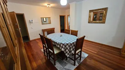 a dining room table with a checkered table cloth on it at Garajau Paradise Apartment in Caniço