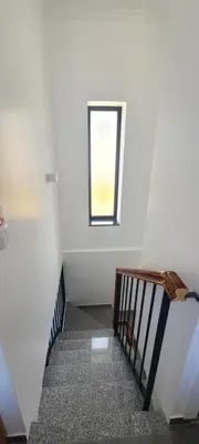 a staircase with a window in a white room at Quinta Das Rosas 5 in Estreito da Calheta