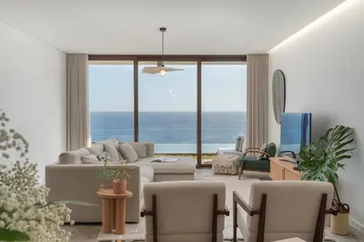 a living room with a view of the ocean at Islander - Funchal Seaside Villas in Funchal