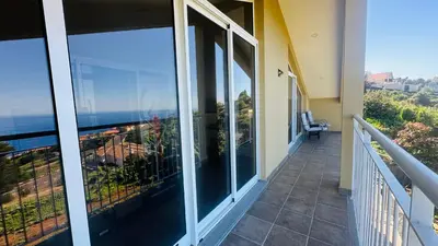 a balcony with a view of the ocean at Casa Malee in Calheta