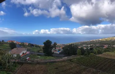 a view of the ocean from a hill at Casa Malee in Calheta