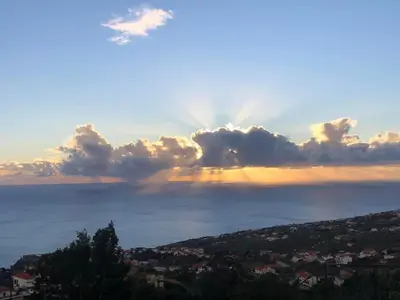 a view of the ocean with a cloudy sky at Casa Malee in Calheta