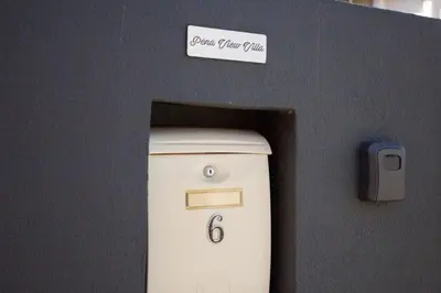 a cash register in an office with a sign on it at Pena View Villa in Santa Cruz