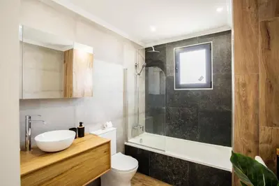 a bathroom with a sink and a toilet and a shower at Pena View Villa in Santa Cruz