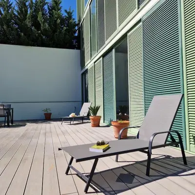 a patio with two chairs and a table on a building at Upscale, spacious & peacefull 3-bedroom apartment in Funchal