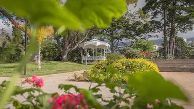 a gazebo in the middle of a park with flowers at Upscale, spacious & peacefull 3-bedroom apartment in Funchal