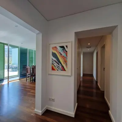 a hallway in a house with a painting on the wall at Upscale, spacious & peacefull 3-bedroom apartment in Funchal