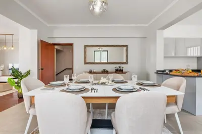 a dining room with a white table and chairs at Glimpse of the City by Homie in Funchal