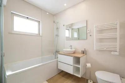 a bathroom with a sink and a toilet and a mirror at Luz Secret by MOJE Holiday in Luz