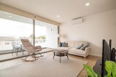 a living room with a couch and a table at Luz Secret by MOJE Holiday in Luz
