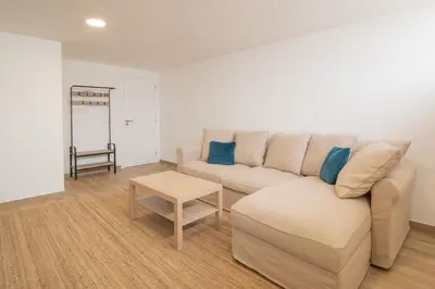 a living room with a couch and a table at Luz Secret by MOJE Holiday in Luz