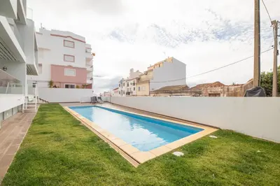 a swimming pool in the backyard of a house at Luz Secret by MOJE Holiday in Luz