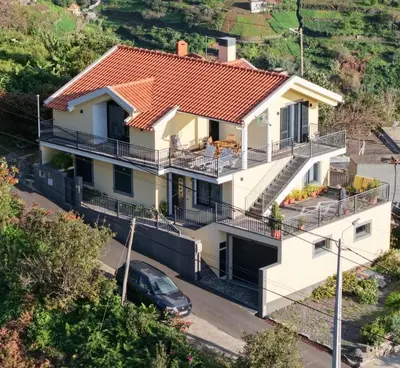an aerial view of a house with an orange roof at BoaVista- 2 bed house -COSY PANORAMIC -SEA - MOUNTAIN VIEW in Campanário