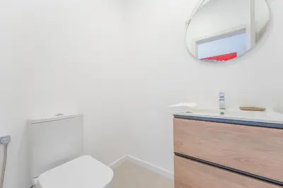 a bathroom with a sink and a mirror at FLH Papaya Villa with Sea View in Funchal
