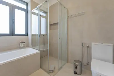 a bathroom with a shower and a toilet and a sink at FLH Papaya Villa with Sea View in Funchal